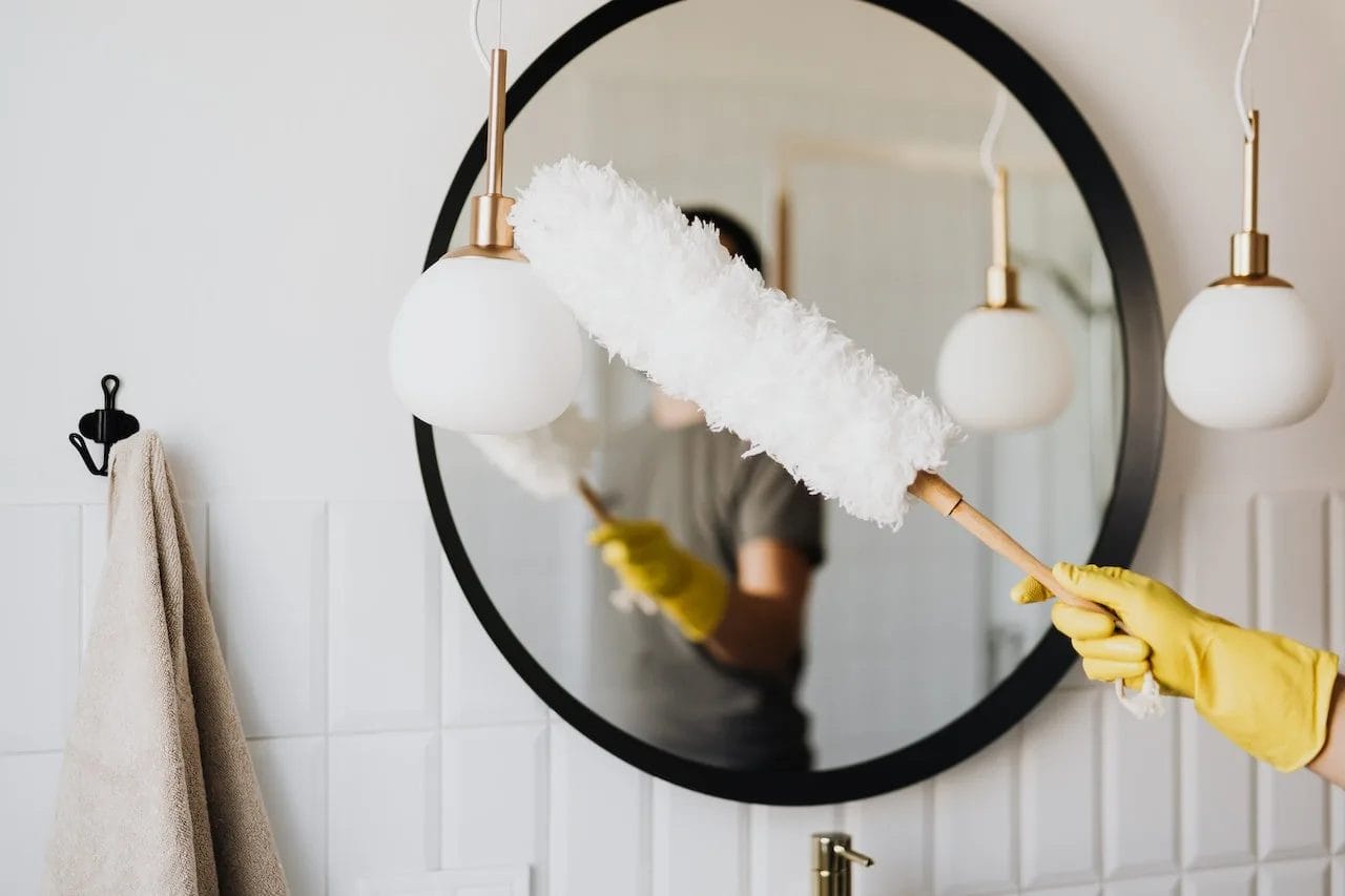 dusting a mirror
