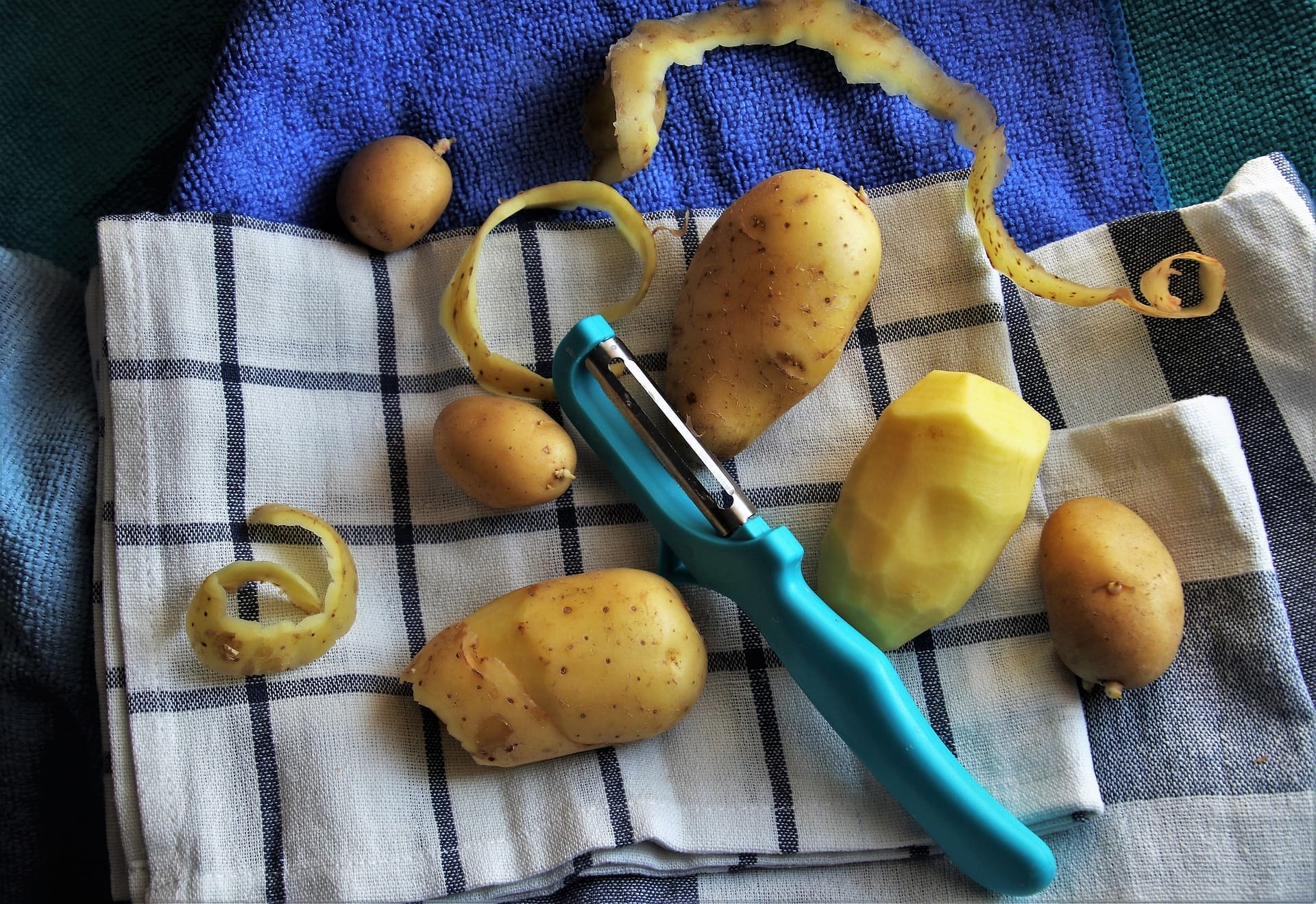 Potatoes in the kitchen with kitchen accessories