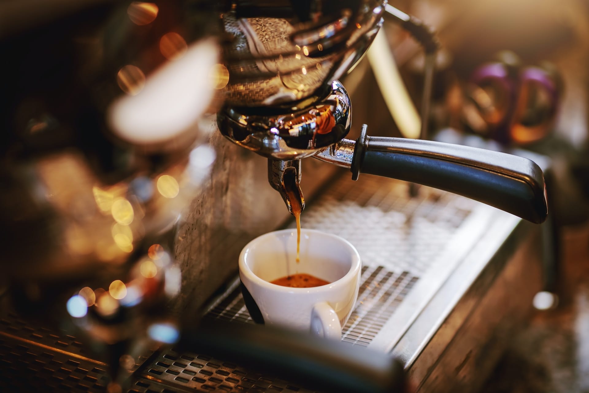 Close up of espresso machine with cup photo